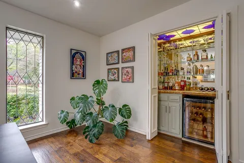 a room with furniture and a potted plant