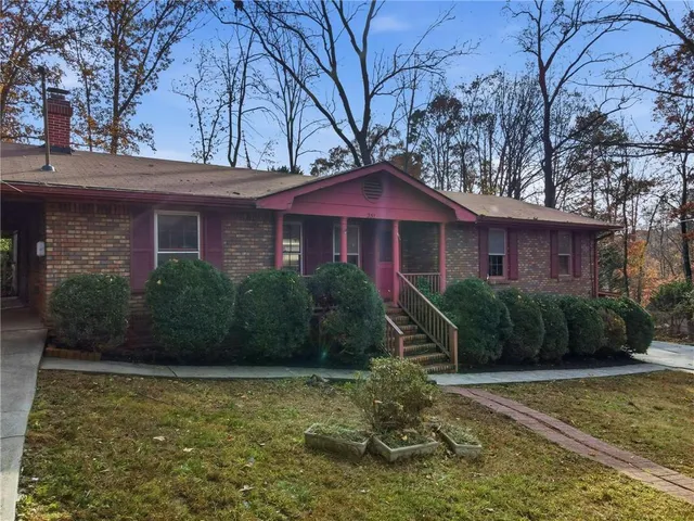 a front view of a house with garden