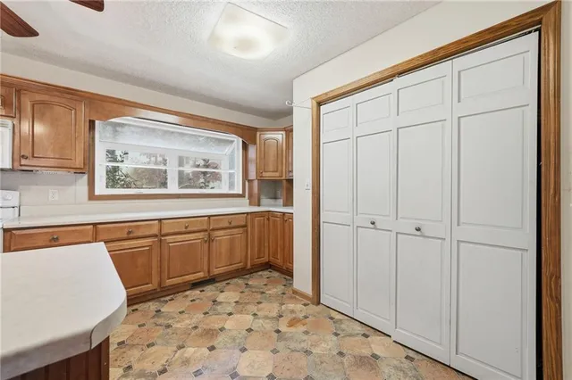 a room with a bed and a dresser