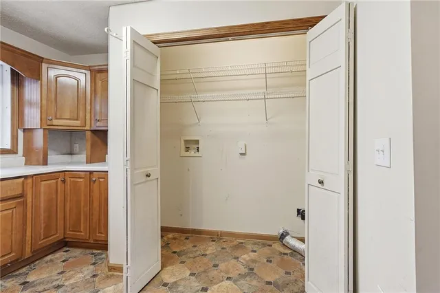 a bathroom with a shower and a sink