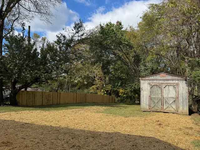 a backyard of a house with lots of green space
