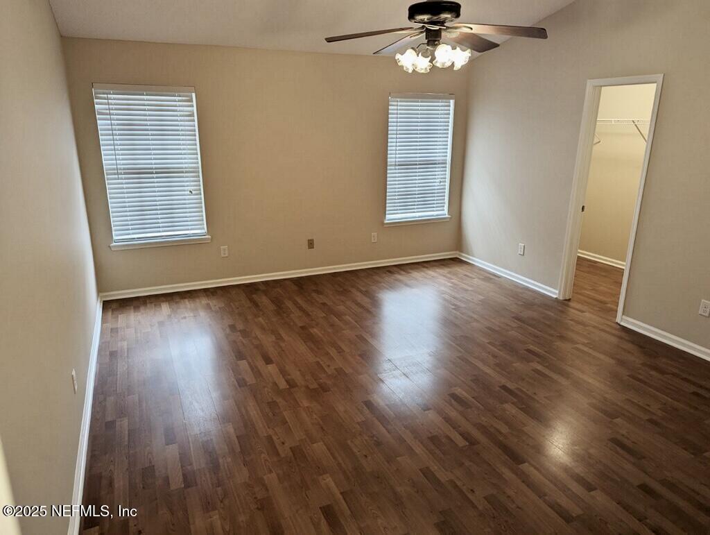 1455 Silver Bell Lane Fleming Island, FL 32003 - Photo 25 of 37 a view of an empty room with wooden floor and a window