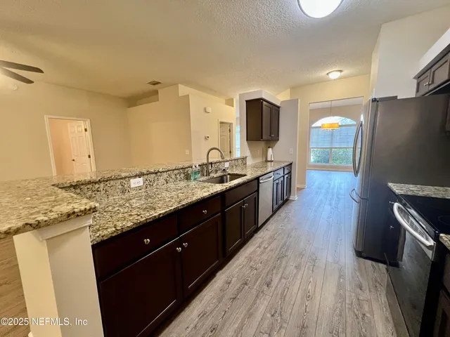 a bathroom with a bathtub a mirror a sink and a shower