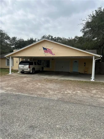 a view of a house with a truck parked