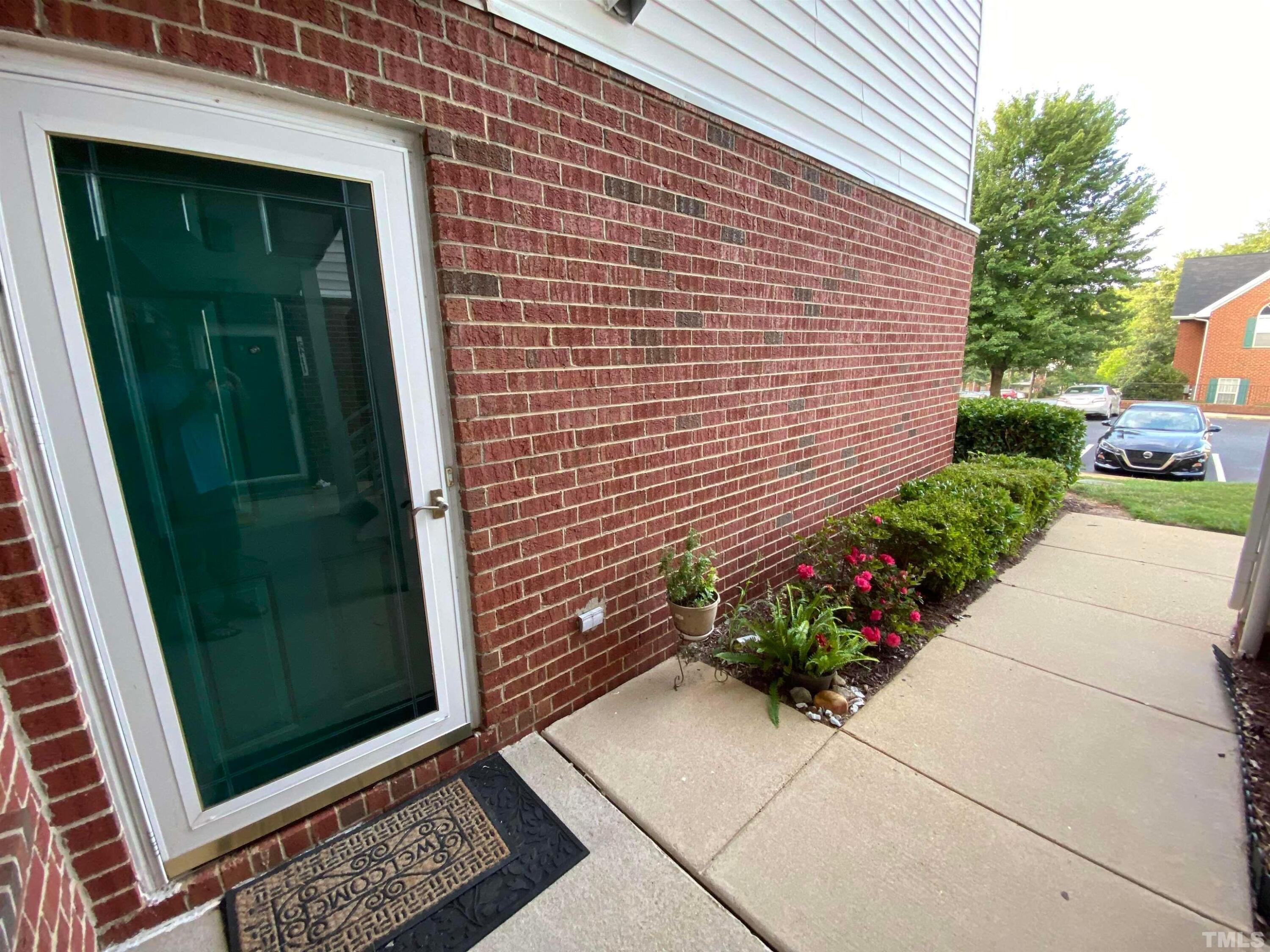 2413 Wellington Ridge Loop, Unit 2413 Cary, NC 27518 - Photo 2 of 30 a view of a door and a outdoor space