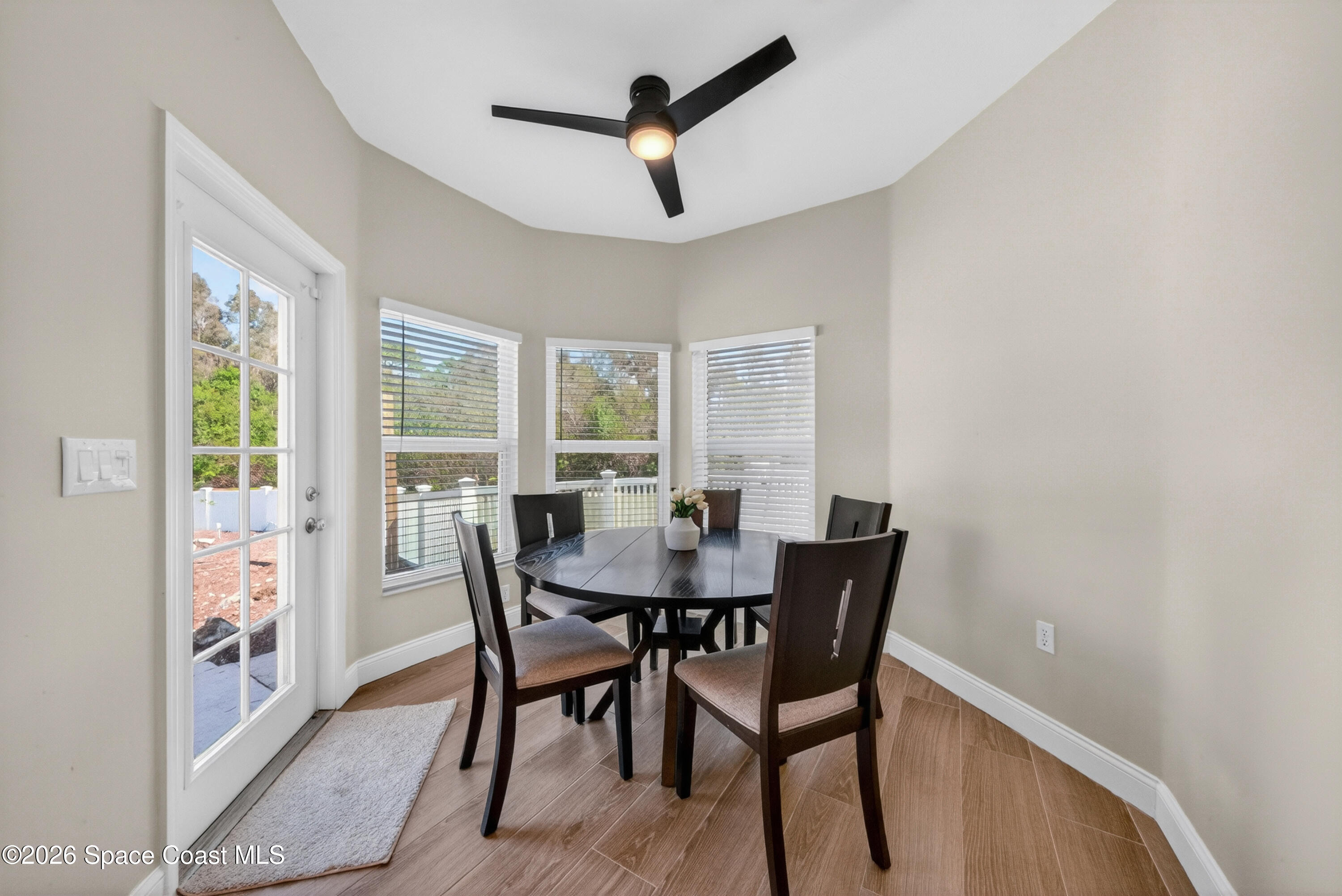 210 Grant Road Merritt Island, FL 32953 - Photo 14 of 64 a view of a dining room with furniture window and outside view