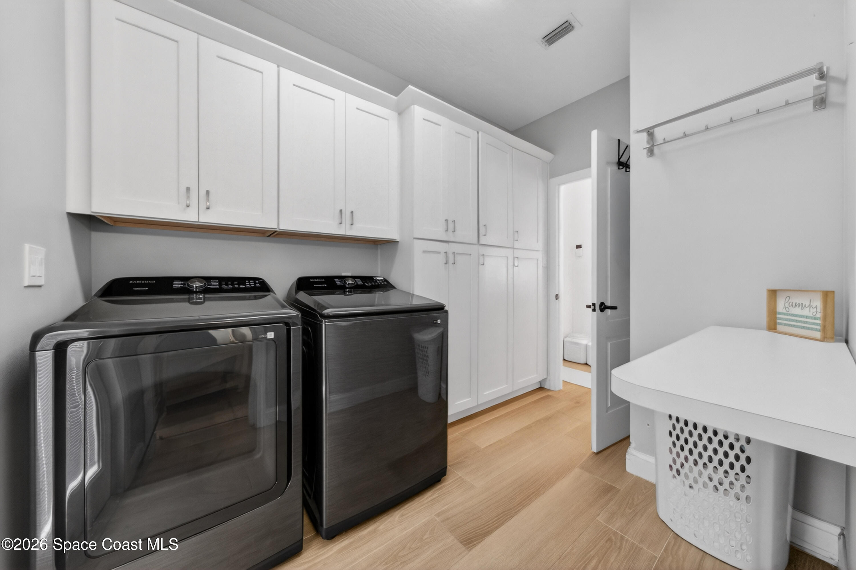 210 Grant Road Merritt Island, FL 32953 - Photo 16 of 64 a kitchen with stainless steel appliances a cabinets and a stove top oven