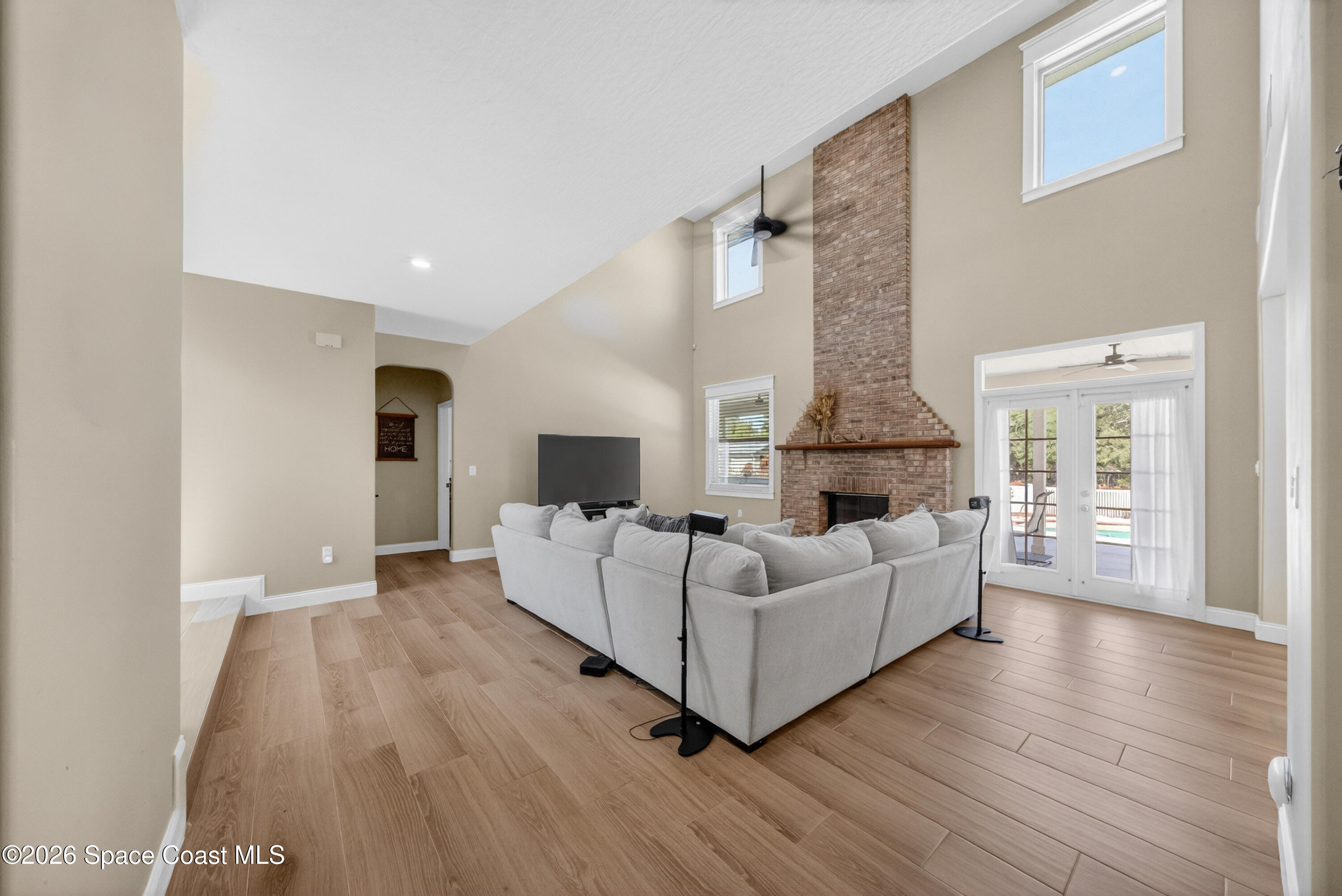 210 Grant Road Merritt Island, FL 32953 - Photo 23 of 64 a living room with furniture and a fireplace