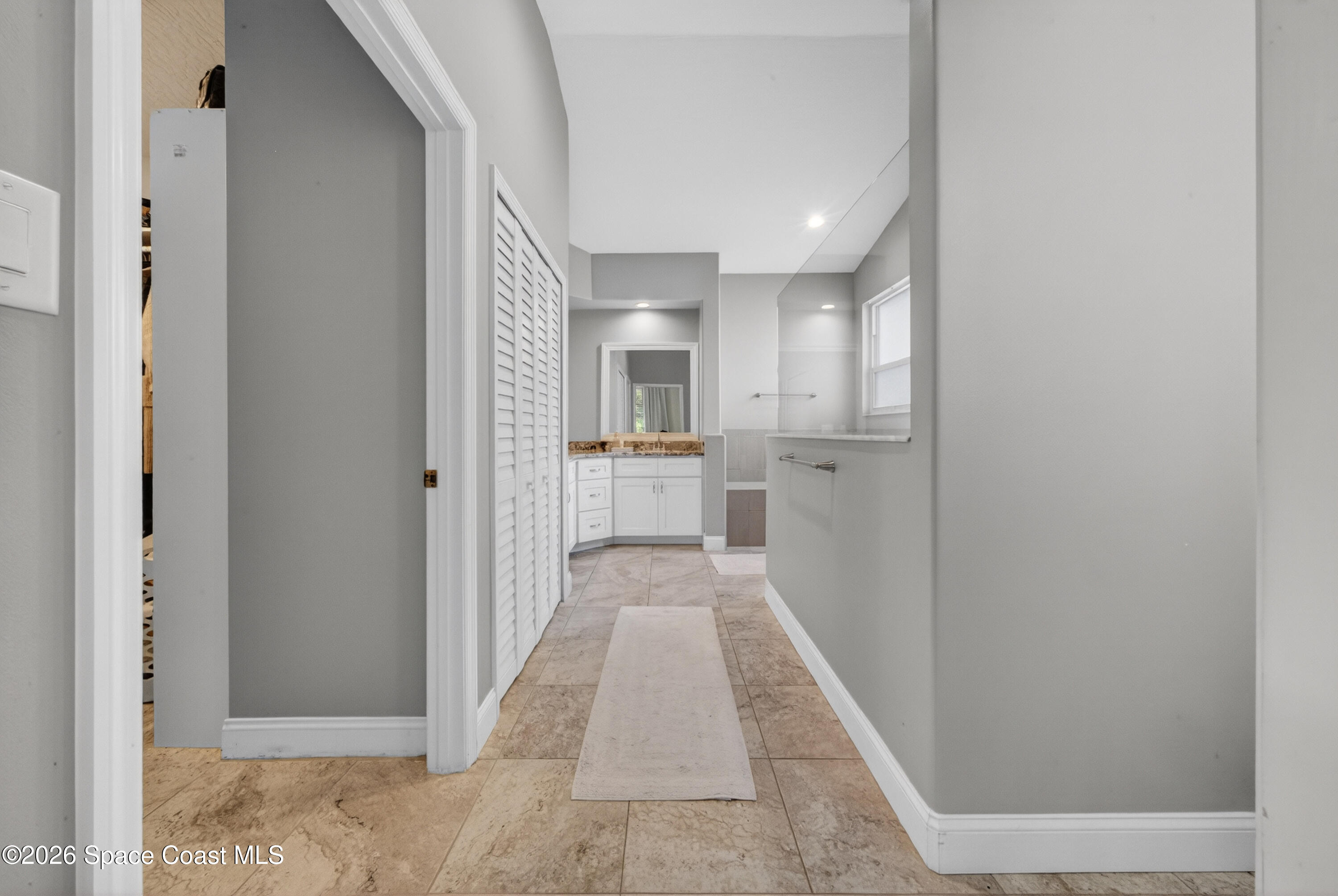 210 Grant Road Merritt Island, FL 32953 - Photo 26 of 64 a view of a hallway with a kitchen