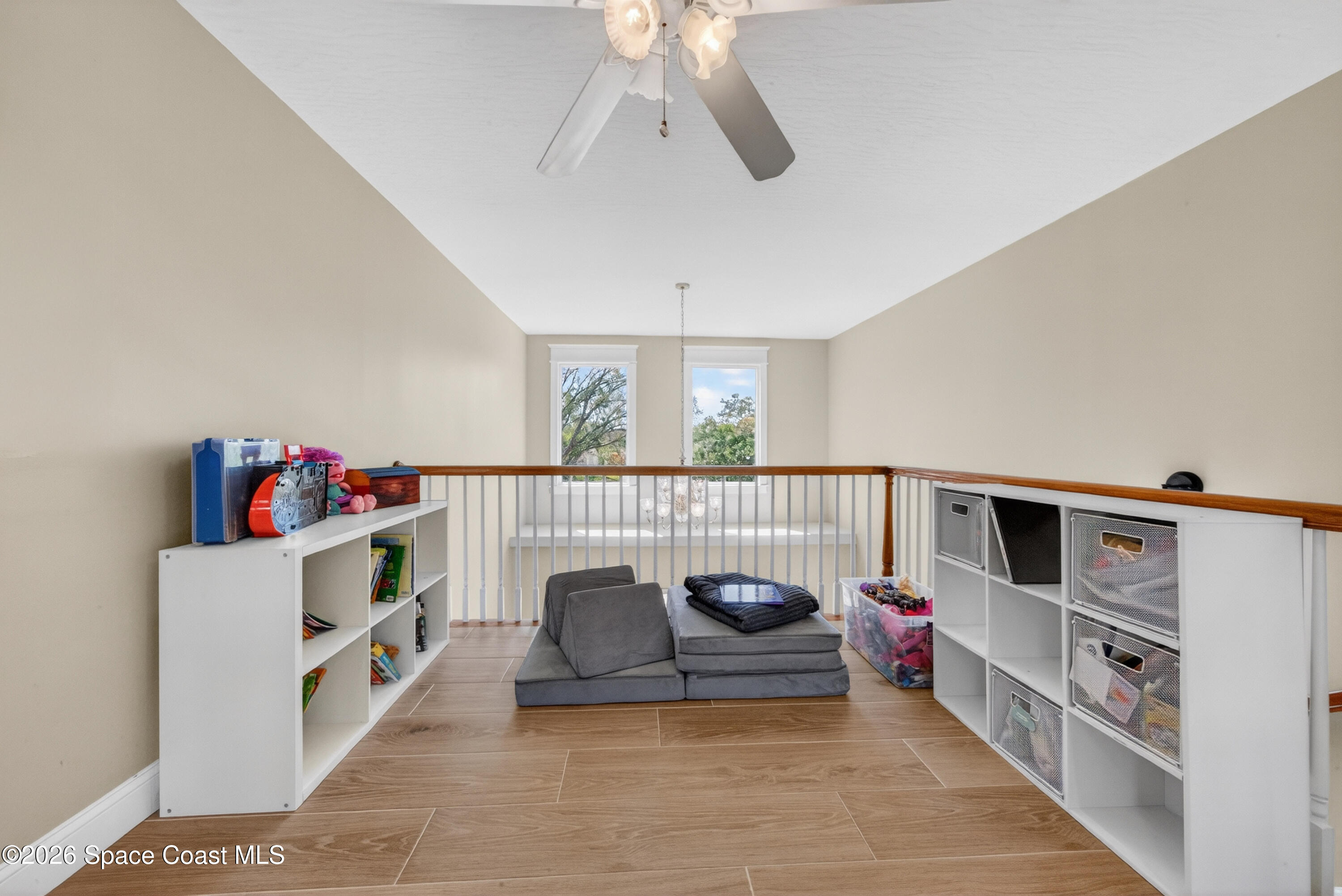 210 Grant Road Merritt Island, FL 32953 - Photo 34 of 64 a living room with furniture and a flat screen tv