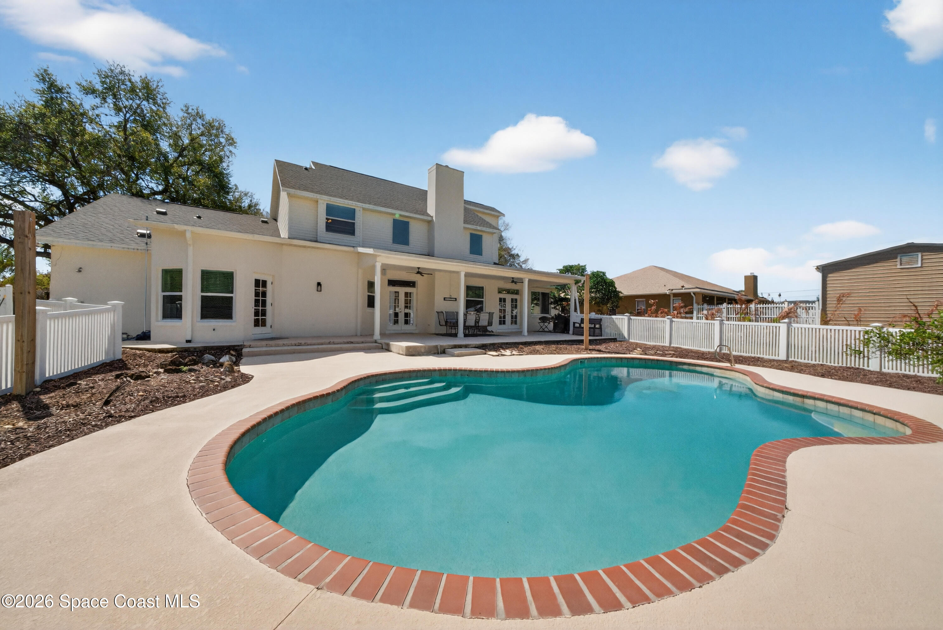 210 Grant Road Merritt Island, FL 32953 - Photo 45 of 64 a view of a swimming pool with a patio
