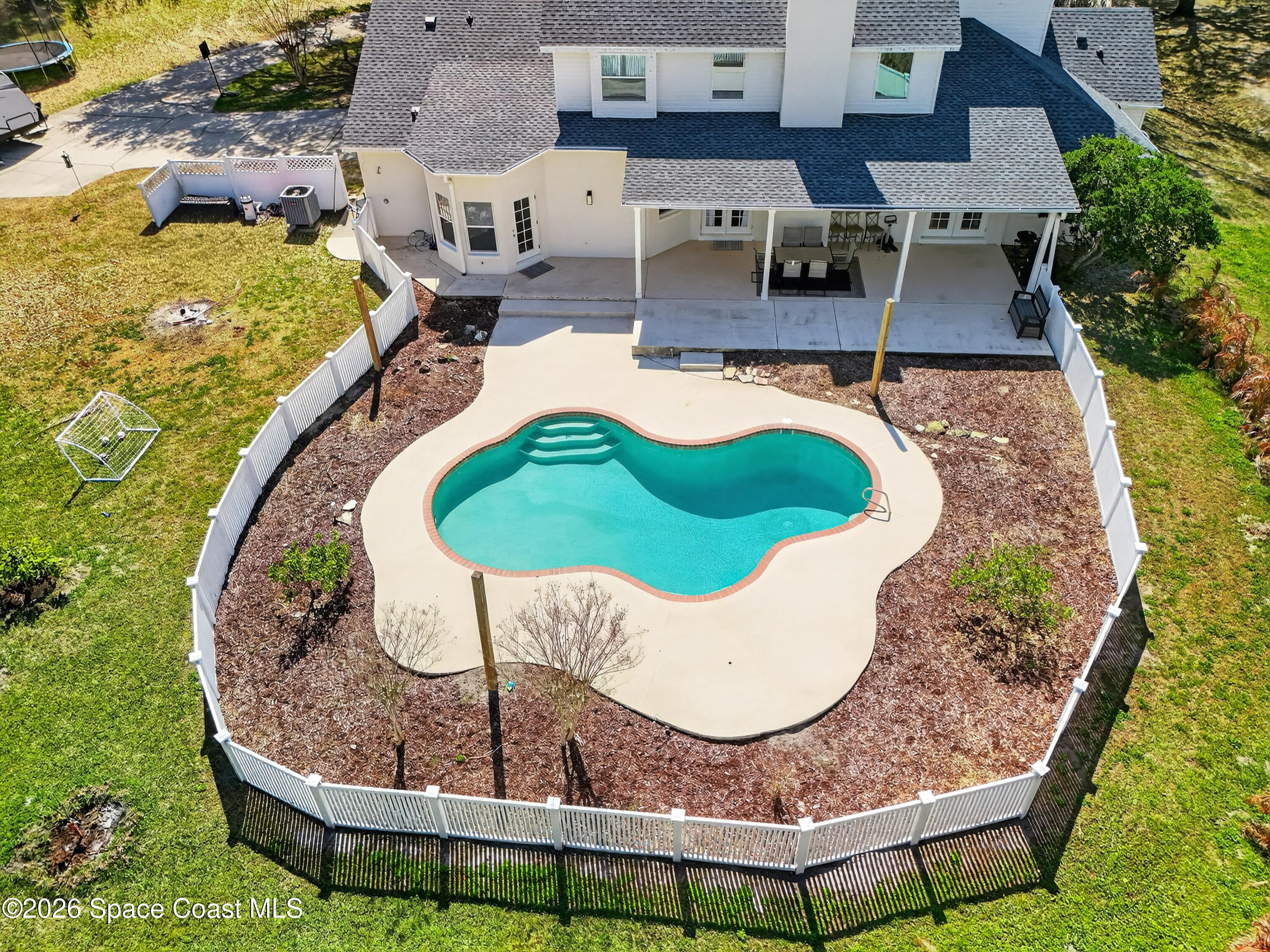 210 Grant Road Merritt Island, FL 32953 - Photo 47 of 64 an aerial view of a house with swimming pool and outdoor seating