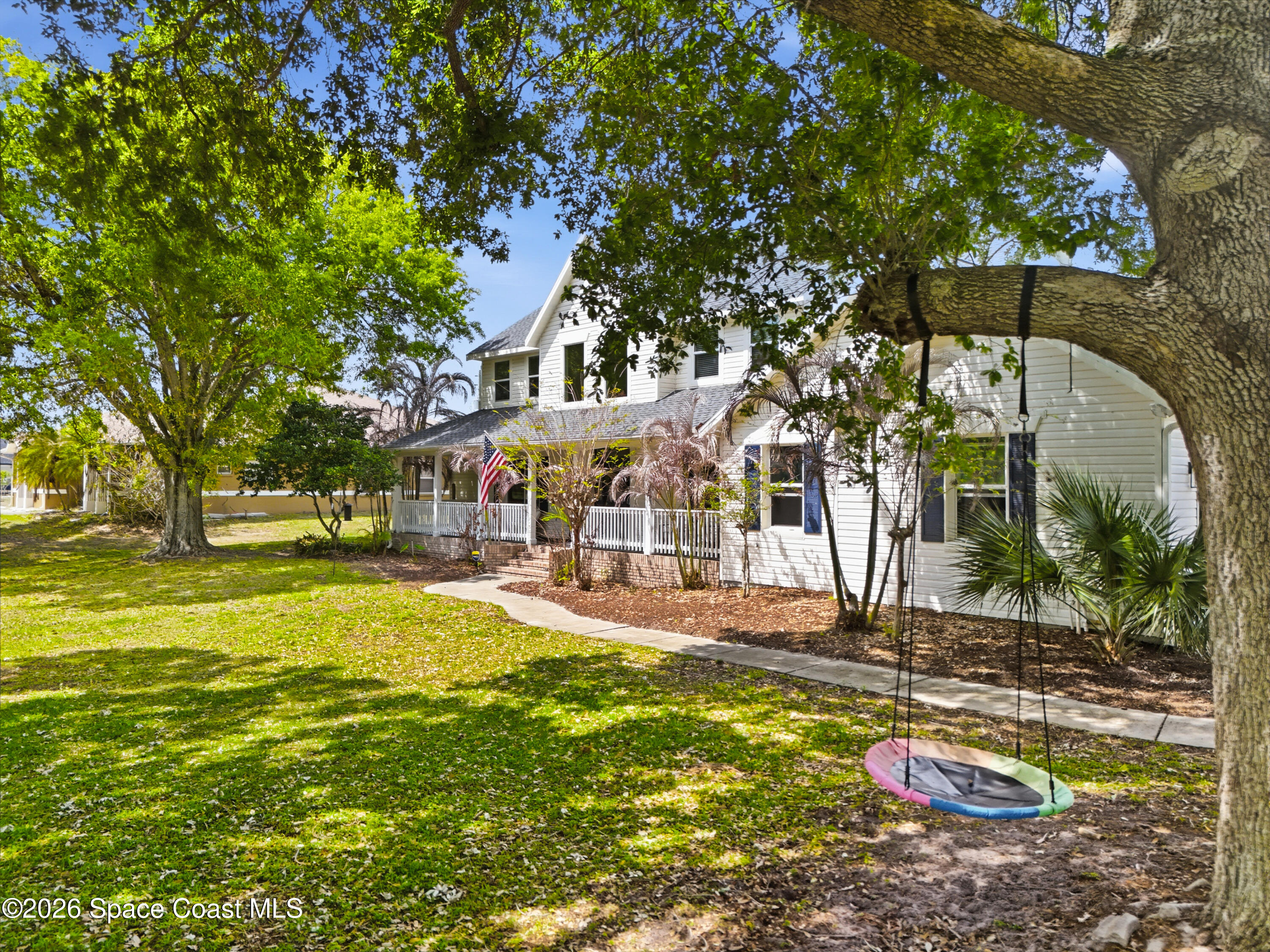 210 Grant Road Merritt Island, FL 32953 - Photo 55 of 64 a view of a house with swimming pool