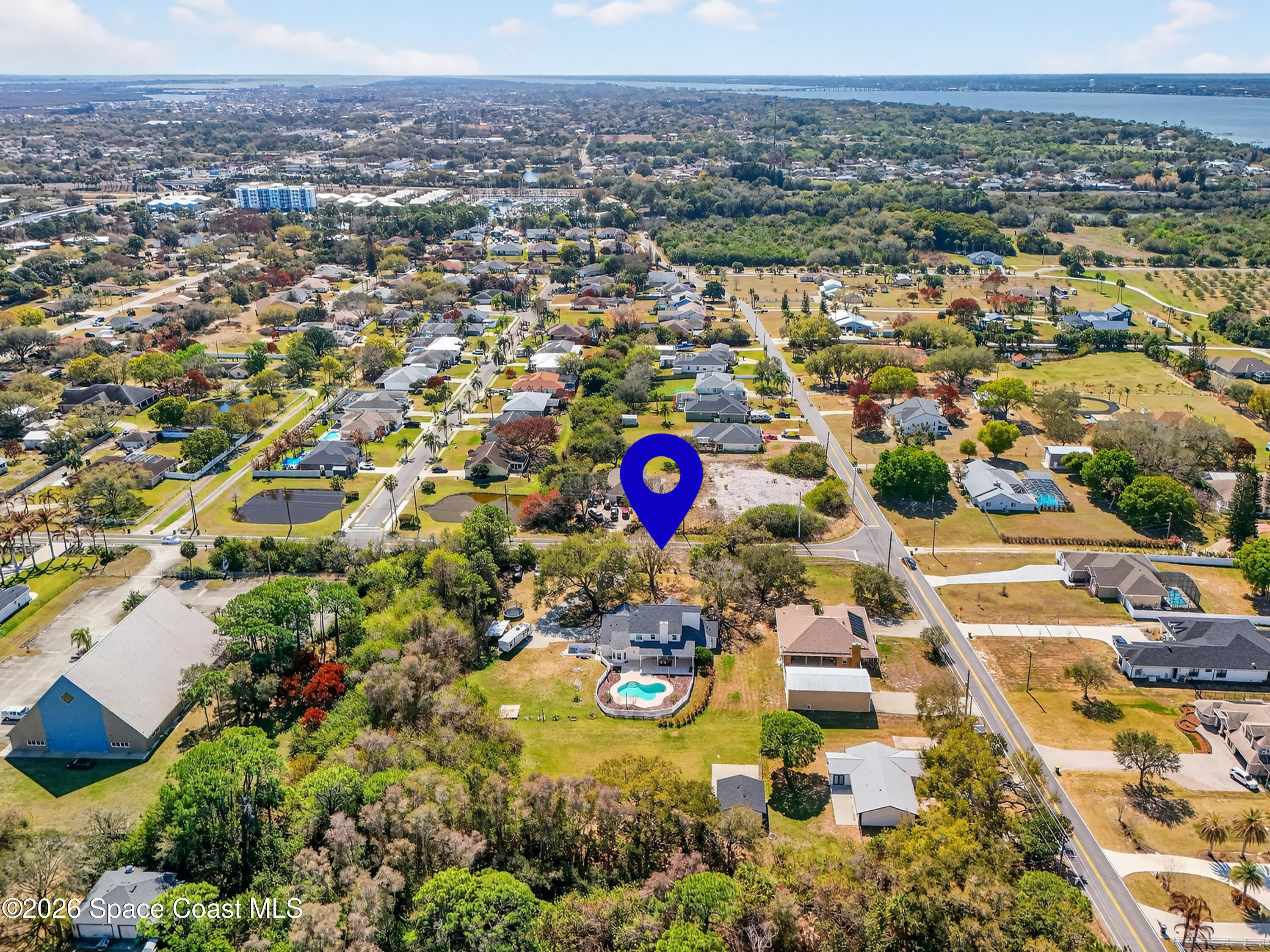 210 Grant Road Merritt Island, FL 32953 - Photo 61 of 64 an aerial view of residential houses with outdoor space