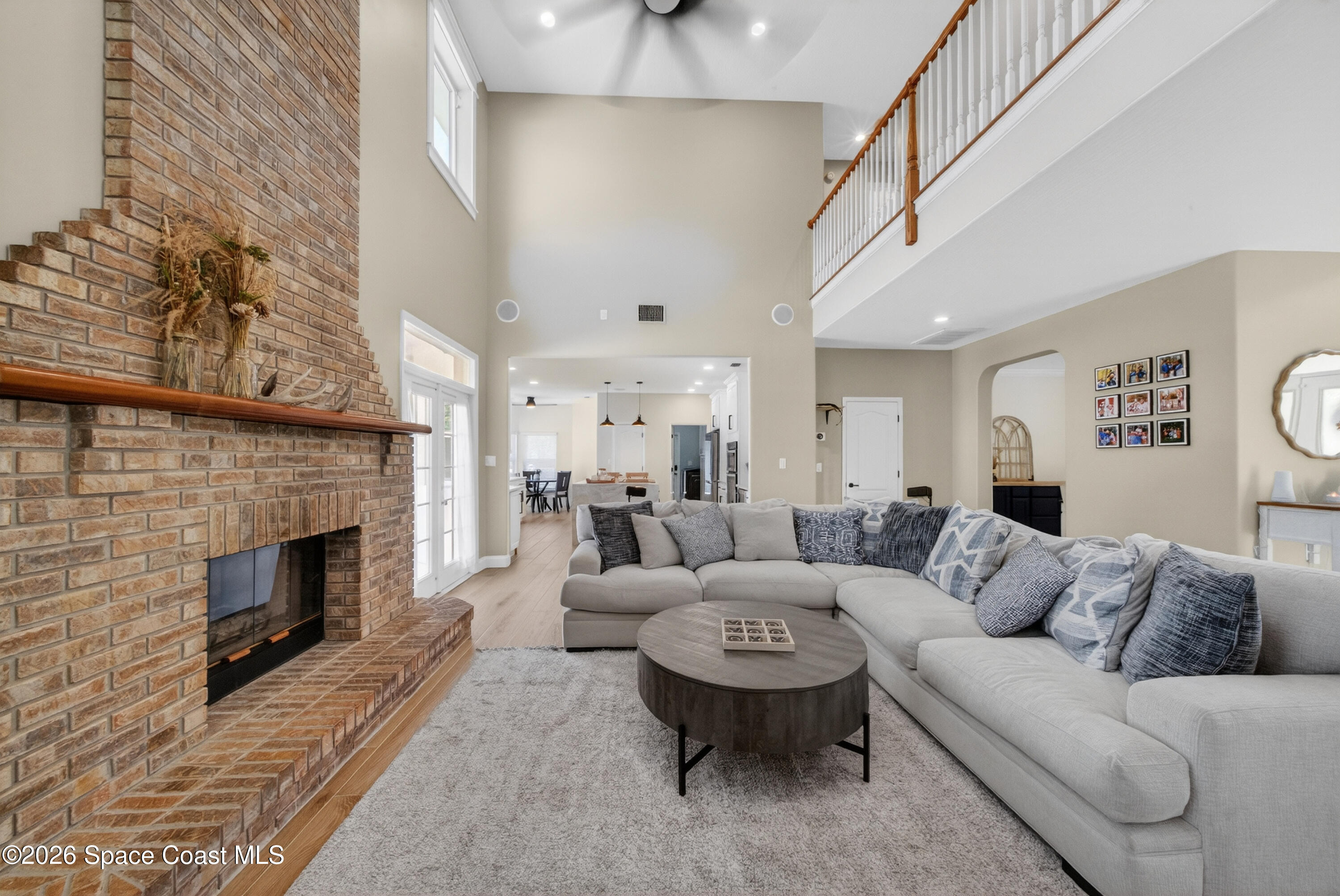 210 Grant Road Merritt Island, FL 32953 - Photo 10 of 64 a living room with furniture and a fireplace