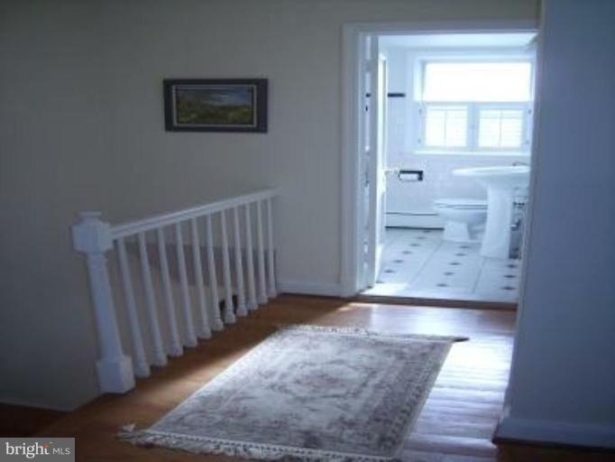 1910 Crestview Road Baltimore, MD 21239 - Photo 12 of 21 a view of a hallway with wooden floor
