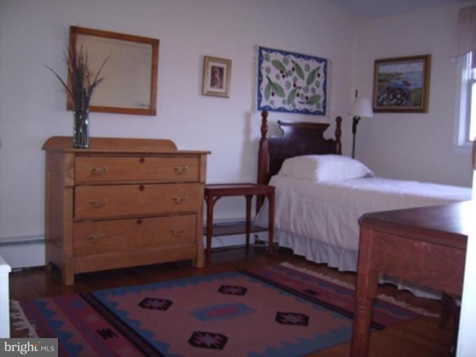 1910 Crestview Road Baltimore, MD 21239 - Photo 15 of 21 a bedroom with a bed and a dresser