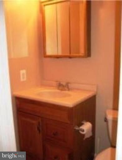 1910 Crestview Road Baltimore, MD 21239 - Photo 18 of 21 a bathroom with a sink and a toilet