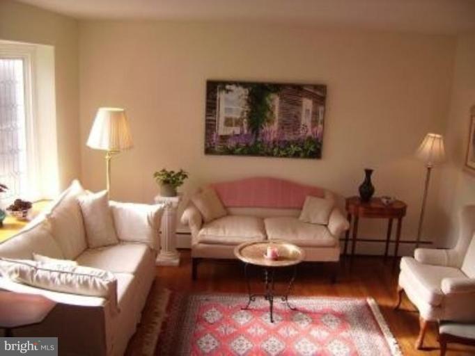 1910 Crestview Road Baltimore, MD 21239 - Photo 3 of 21 a living room with furniture a rug and a lamp