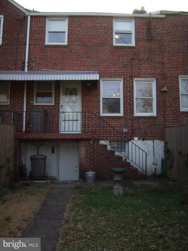 1910 Crestview Road Baltimore, MD 21239 - Photo 21 of 21 a brick building with a yard in front of it