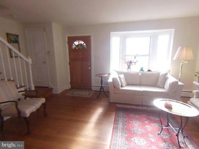 1910 Crestview Road Baltimore, MD 21239 - Photo 4 of 21 a living room with furniture and a lamp