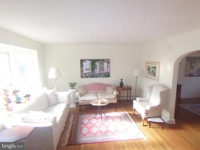 1910 Crestview Road Baltimore, MD 21239 - Photo 5 of 21 a living room with furniture a rug and a table