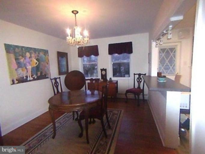 1910 Crestview Road Baltimore, MD 21239 - Photo 6 of 21 a view of a livingroom with furniture and a chandelier