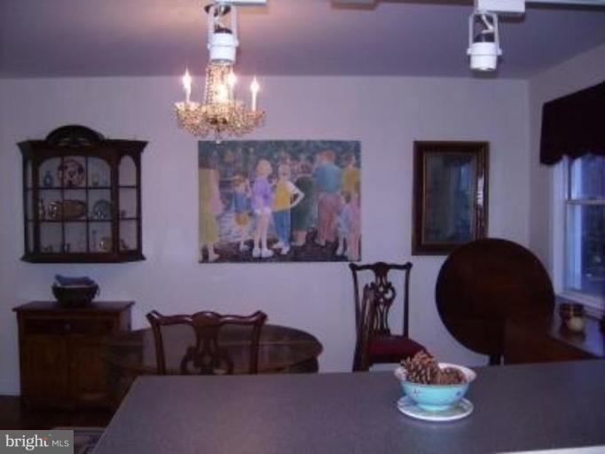 1910 Crestview Road Baltimore, MD 21239 - Photo 7 of 21 a living room with furniture and a chandelier
