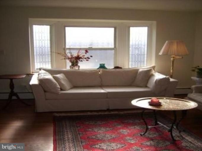 1910 Crestview Road Baltimore, MD 21239 - Photo 8 of 21 a living room with furniture and a large window