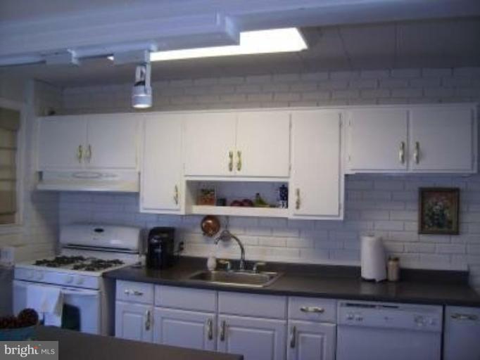 1910 Crestview Road Baltimore, MD 21239 - Photo 9 of 21 a kitchen with stainless steel appliances granite countertop a sink a stove and cabinets