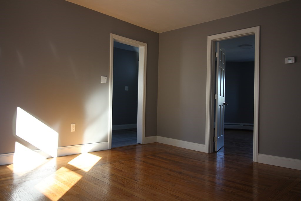 6 Aberdeen Street Fall River, MA 02721 - Photo 12 of 30 a view of an empty room with wooden floor and closet
