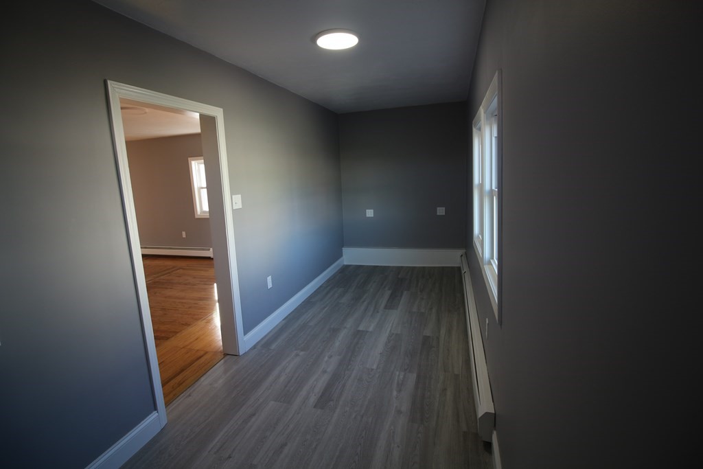 6 Aberdeen Street Fall River, MA 02721 - Photo 14 of 30 wooden floor in an empty room with a mirror