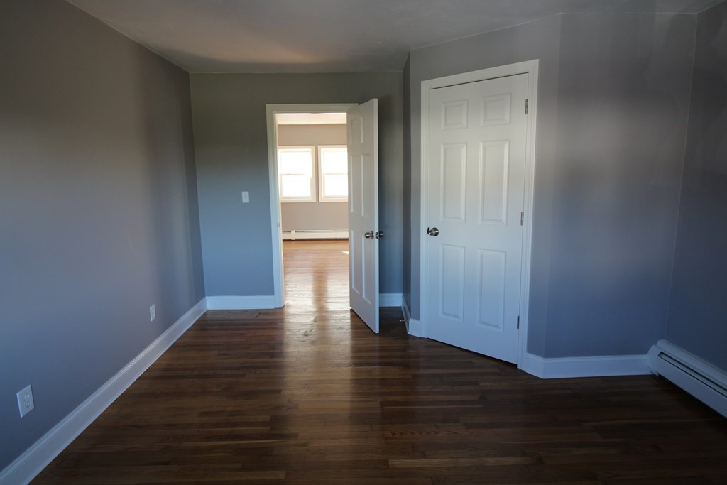 6 Aberdeen Street Fall River, MA 02721 - Photo 16 of 30 a view of an empty room with wooden floor and a window