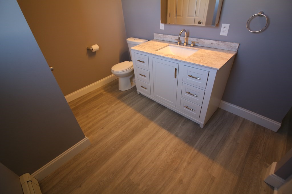 6 Aberdeen Street Fall River, MA 02721 - Photo 19 of 30 a spacious bathroom with a granite countertop toilet and a sink