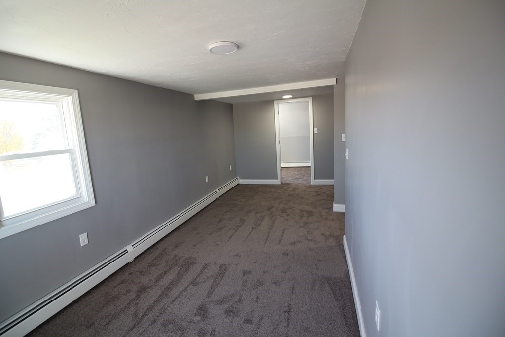 6 Aberdeen Street Fall River, MA 02721 - Photo 21 of 30 an empty room with wooden floor and windows
