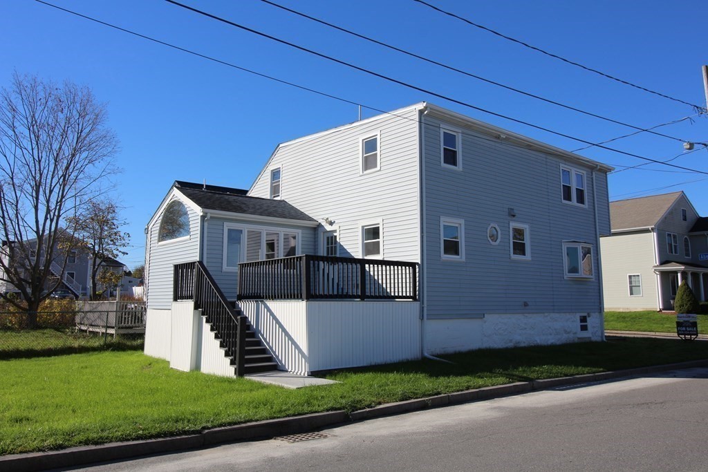 6 Aberdeen Street Fall River, MA 02721 - Photo 6 of 30 a front view of a house with a yard