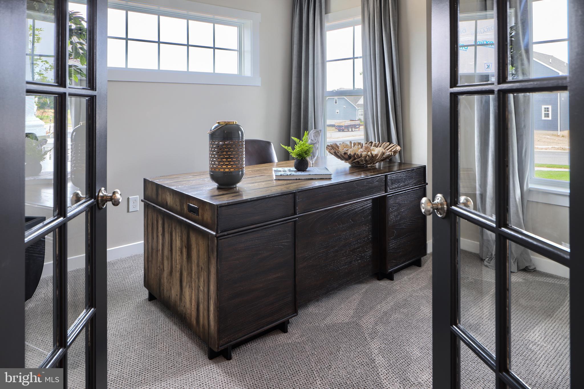 202 Angelica Way New Freedom, PA 17349 - Photo 13 of 48 a kitchen with stainless steel appliances granite countertop a stove a refrigerator and a window