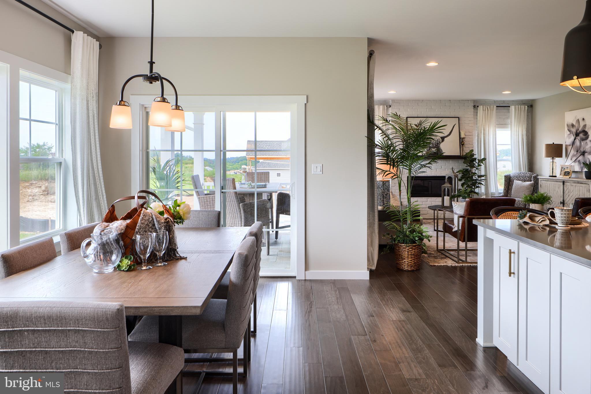 202 Angelica Way New Freedom, PA 17349 - Photo 24 of 48 a view of a dining room with furniture window and wooden floor