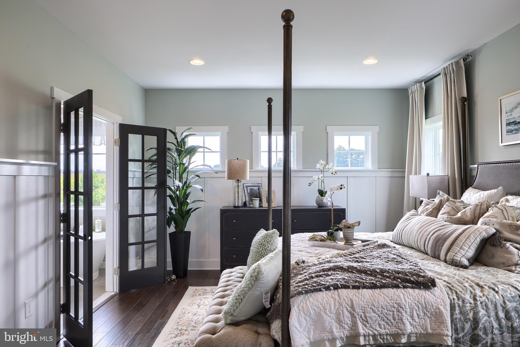 202 Angelica Way New Freedom, PA 17349 - Photo 28 of 48 a bedroom with a bed and wooden floor