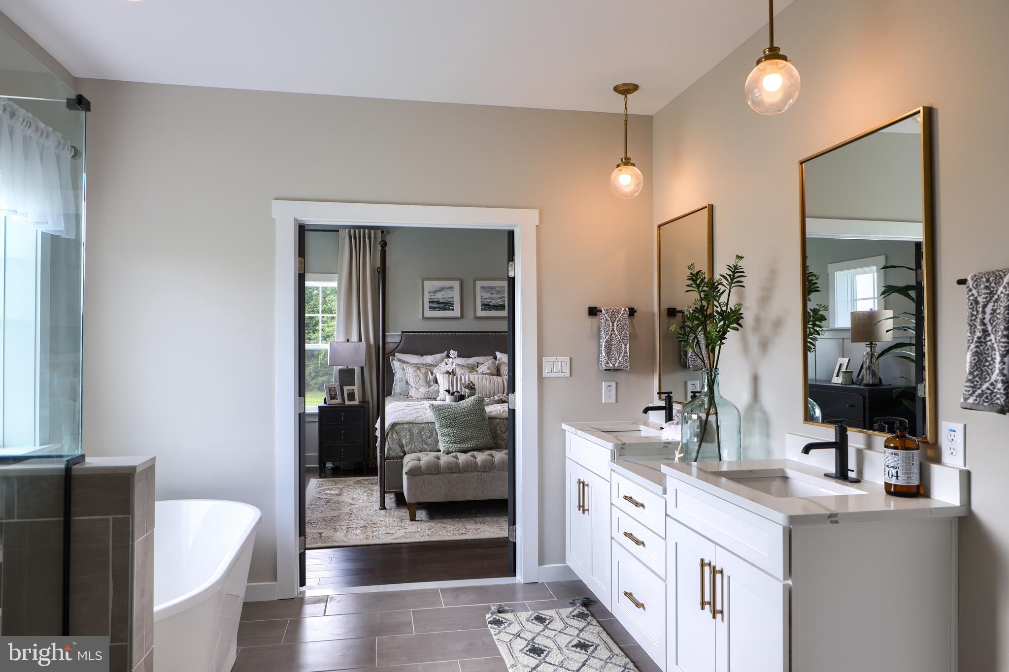 202 Angelica Way New Freedom, PA 17349 - Photo 30 of 48 a spacious en suite bathroom with a double vanity sink a mirror and shower