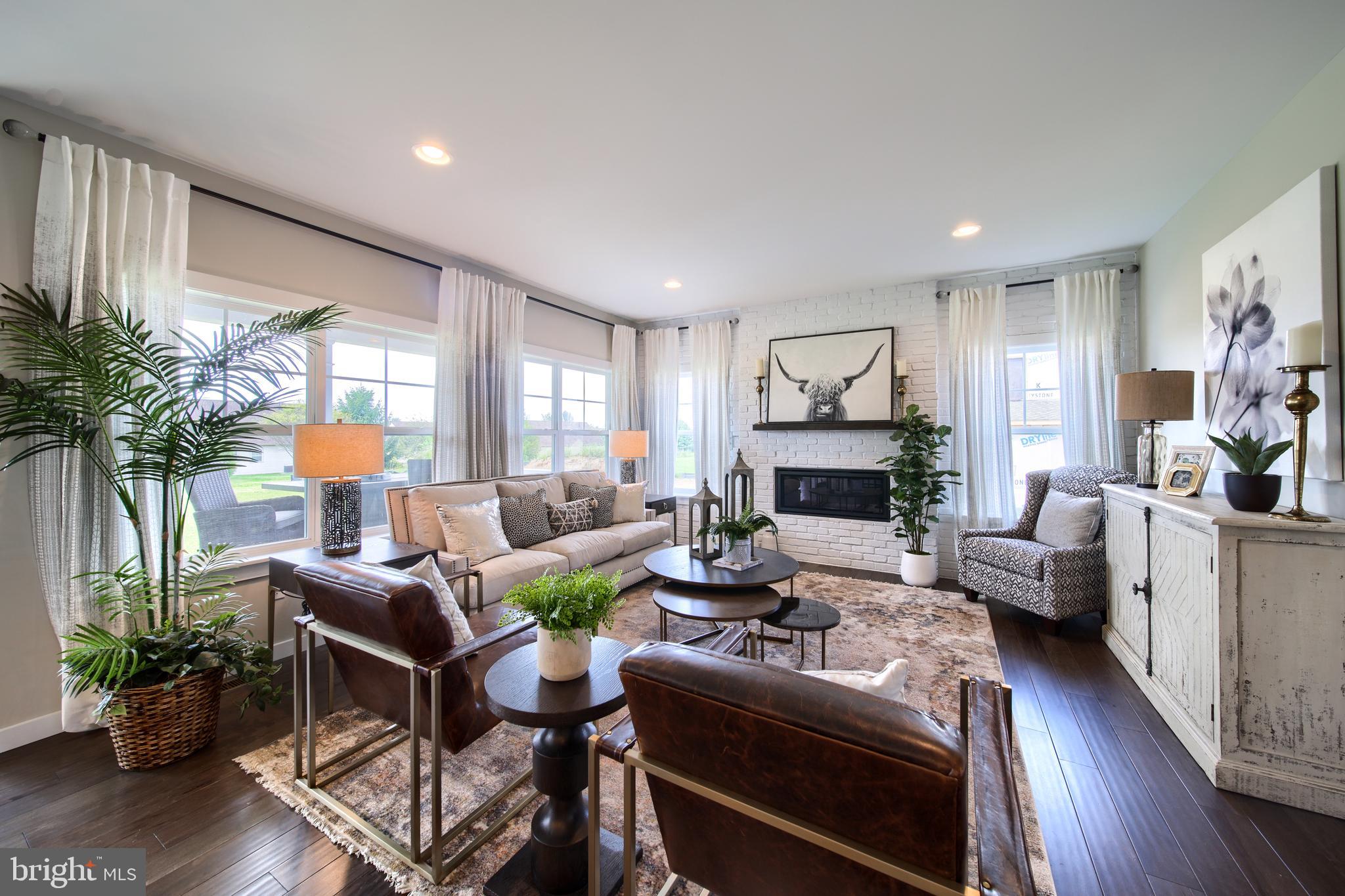 202 Angelica Way New Freedom, PA 17349 - Photo 3 of 48 a living room with fireplace furniture and a wooden floor
