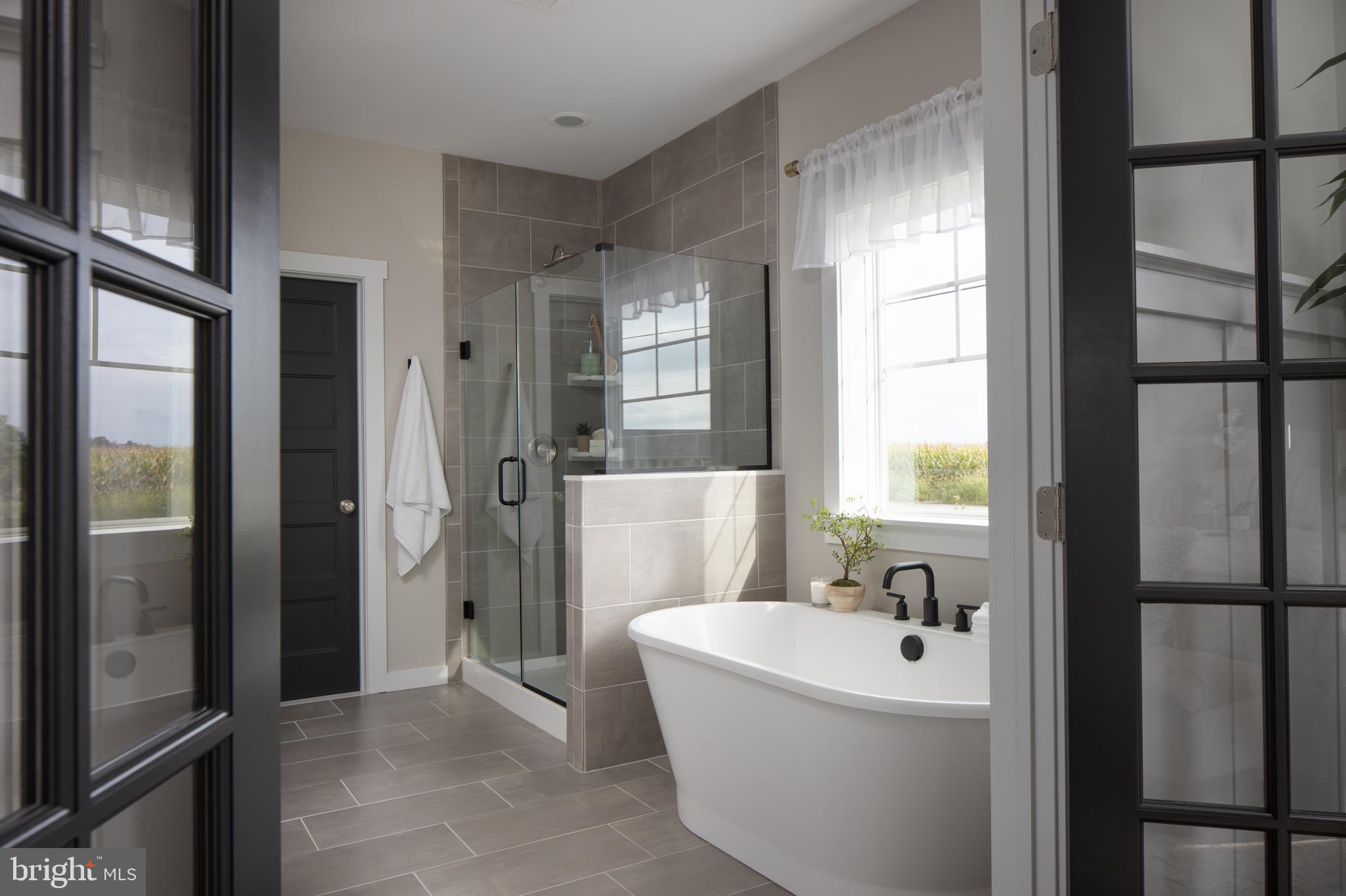 202 Angelica Way New Freedom, PA 17349 - Photo 32 of 48 a bathroom with a bathtub and shower