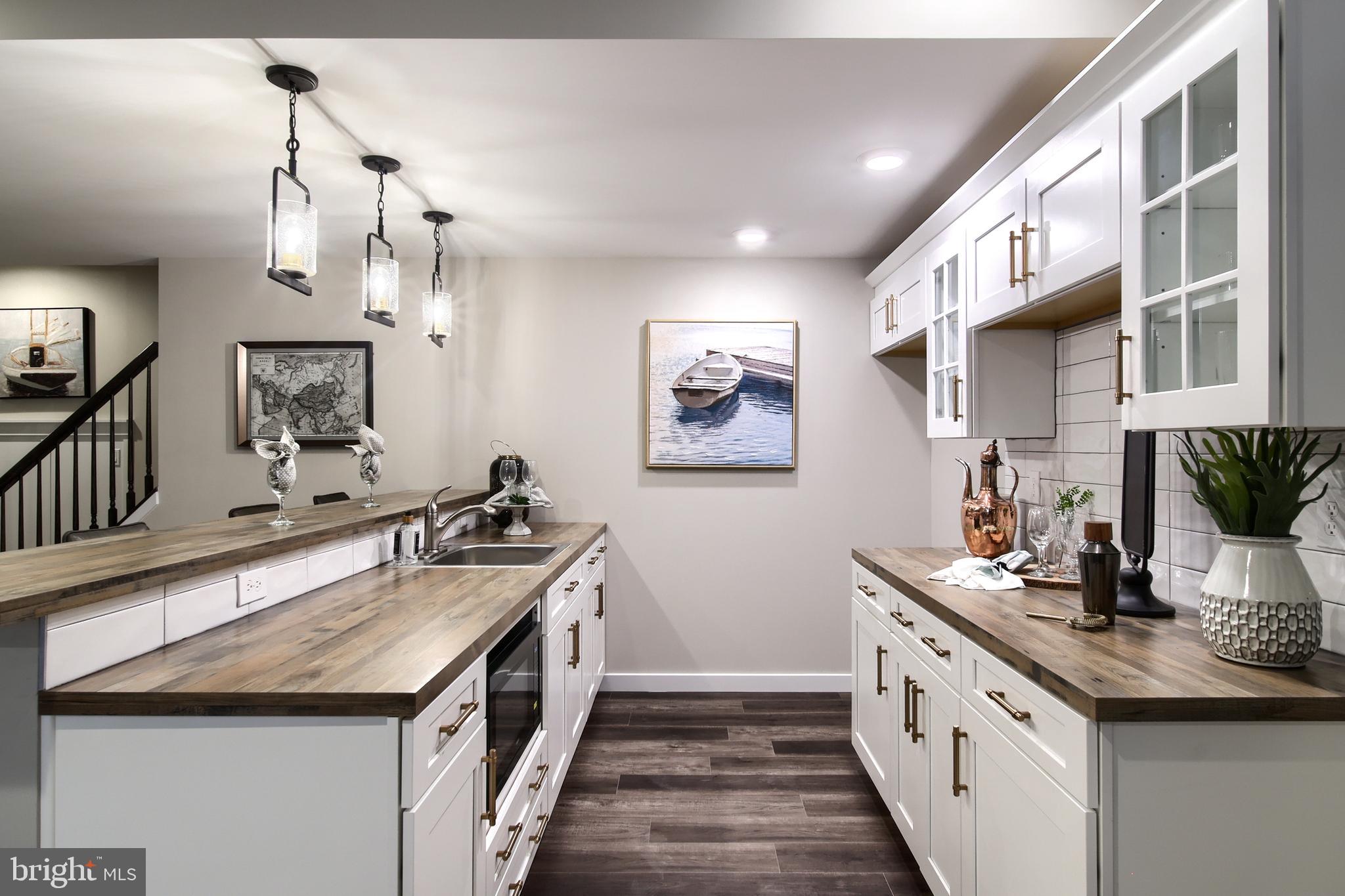 202 Angelica Way New Freedom, PA 17349 - Photo 42 of 48 a kitchen with stainless steel appliances granite countertop a sink and stove