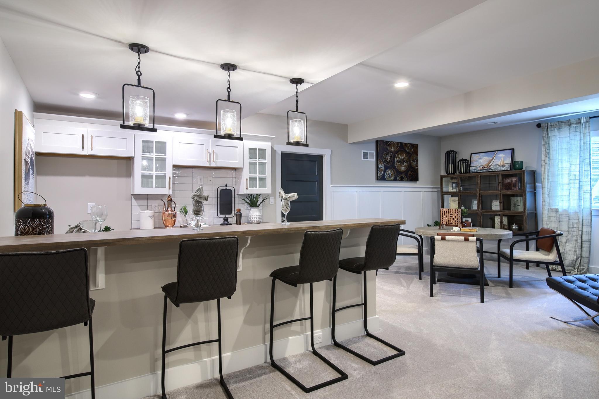202 Angelica Way New Freedom, PA 17349 - Photo 43 of 48 a kitchen with stainless steel appliances kitchen island granite countertop a sink and cabinets