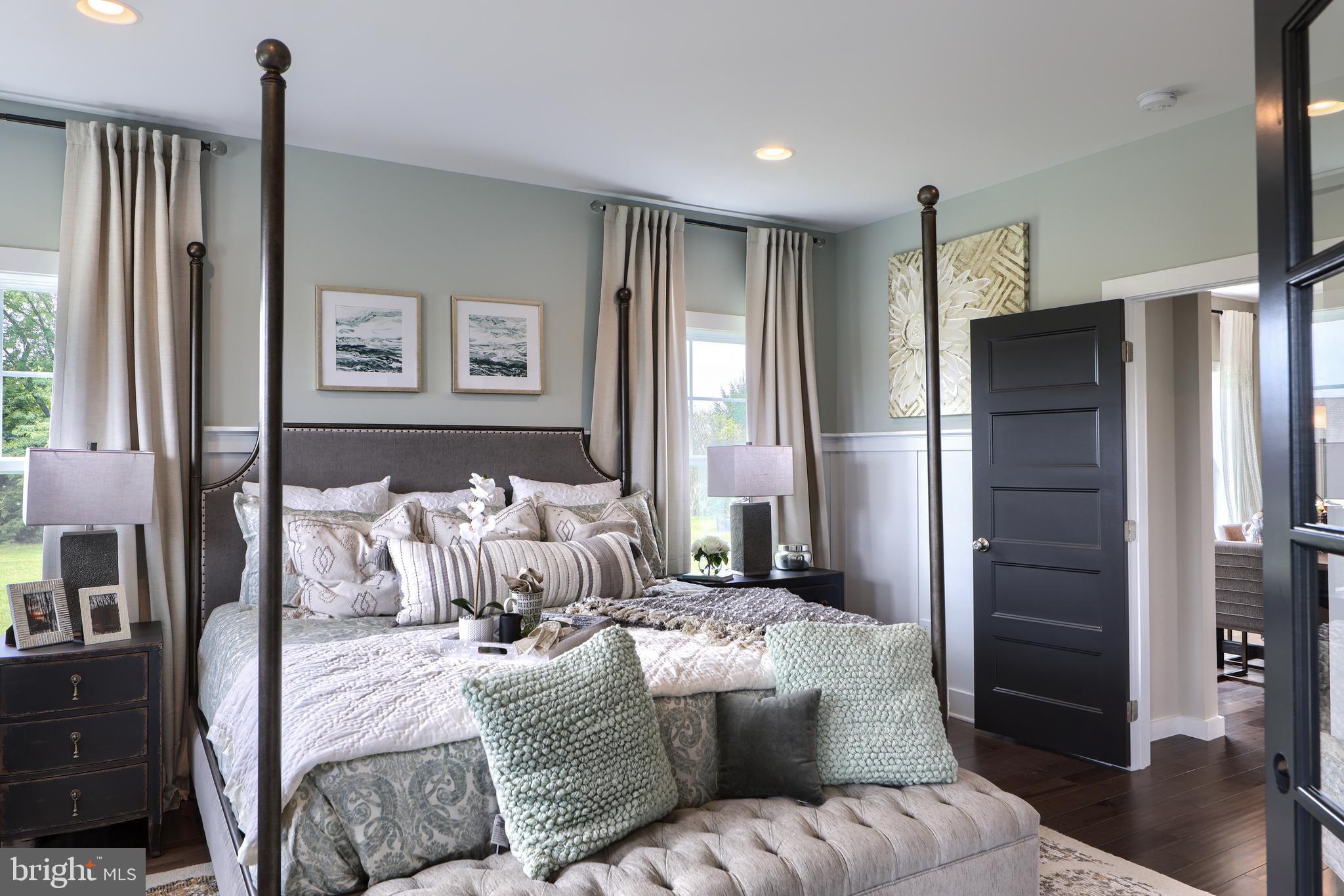 202 Angelica Way New Freedom, PA 17349 - Photo 5 of 48 a large bedroom with bed furniture and a window