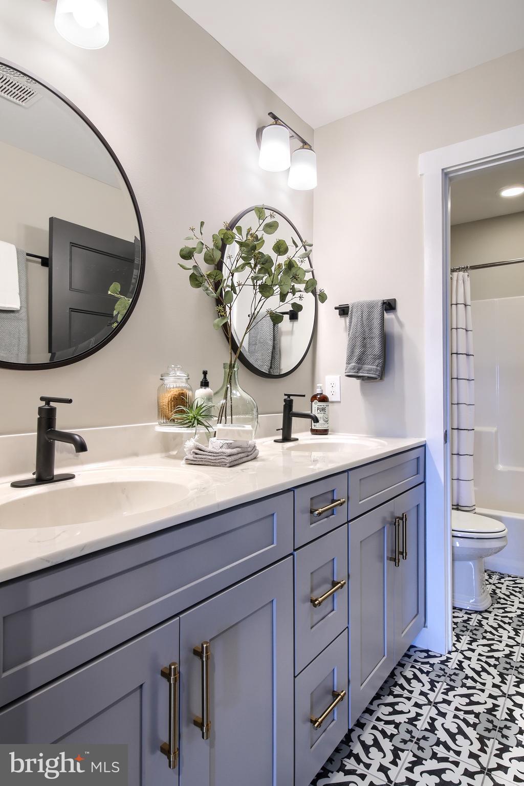 202 Angelica Way New Freedom, PA 17349 - Photo 6 of 48 a bathroom with a granite countertop sink and a mirror