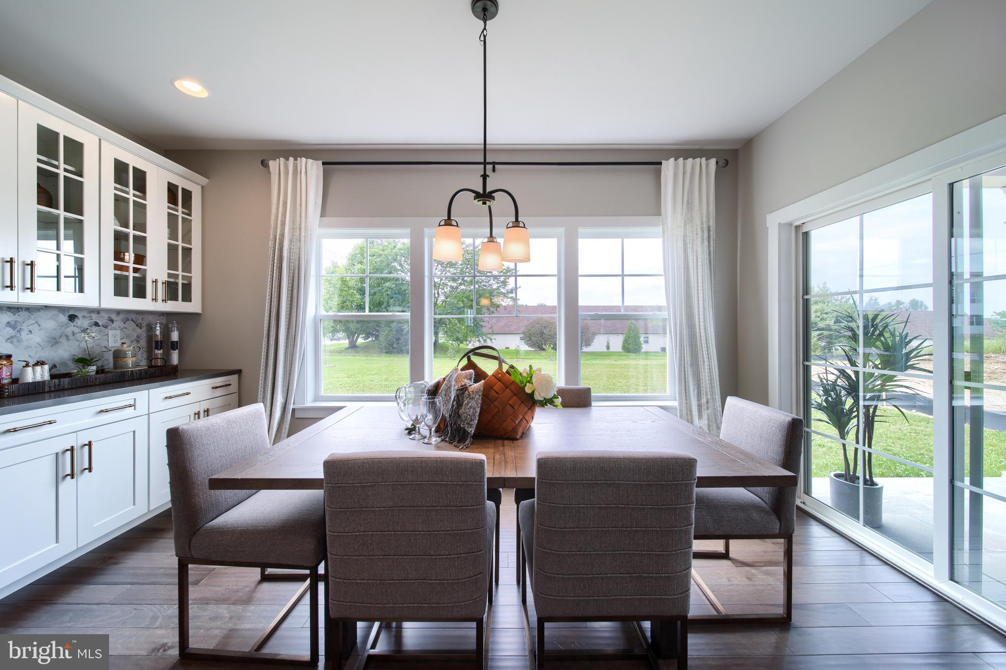 202 Angelica Way New Freedom, PA 17349 - Photo 9 of 48 a dining room with furniture window wooden floor