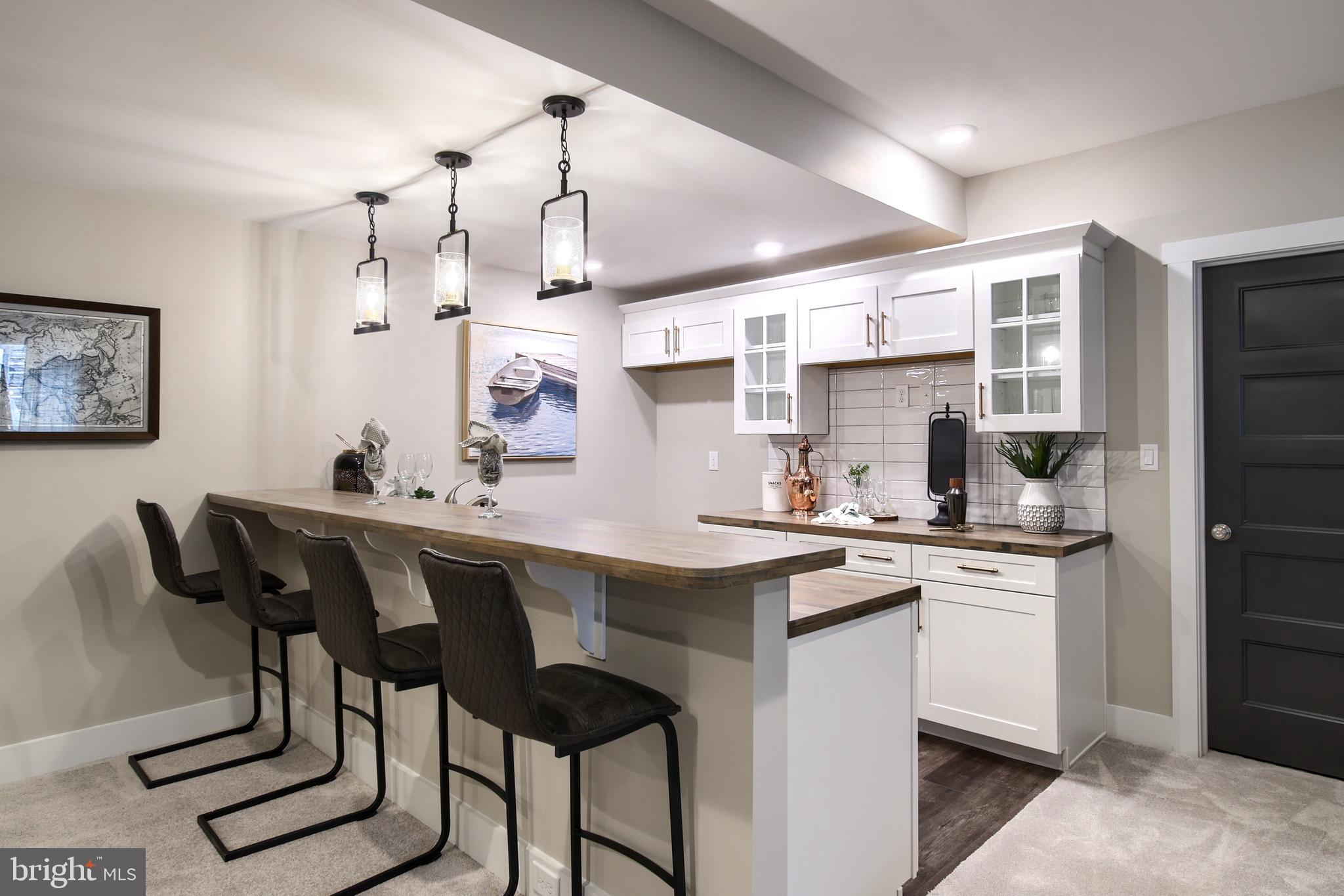 202 Angelica Way New Freedom, PA 17349 - Photo 10 of 48 a kitchen with stainless steel appliances a sink stove and refrigerator