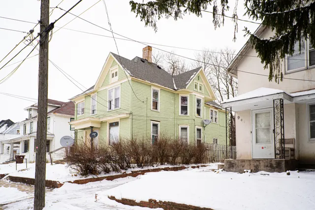 a view of a street with a building in the background