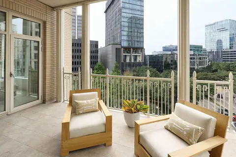 a balcony with furniture and a couch